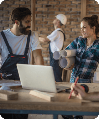 two contractors discussing with laptop