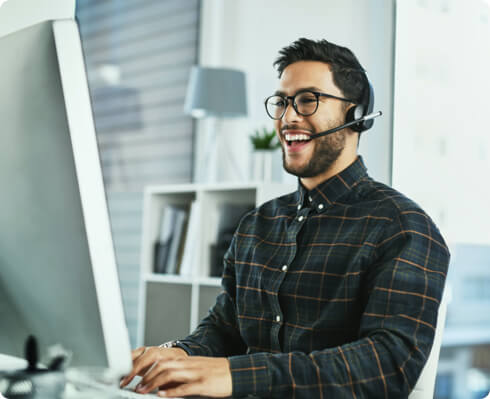 Male receptionist working in desktop