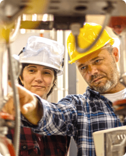 man teaching woman about pipes