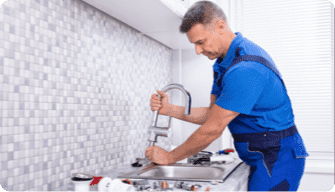 working man fixing the sink